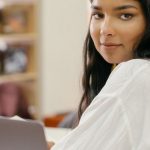 Blended E-learning - Woman in White Long Sleeve Shirt Using Silver Macbook