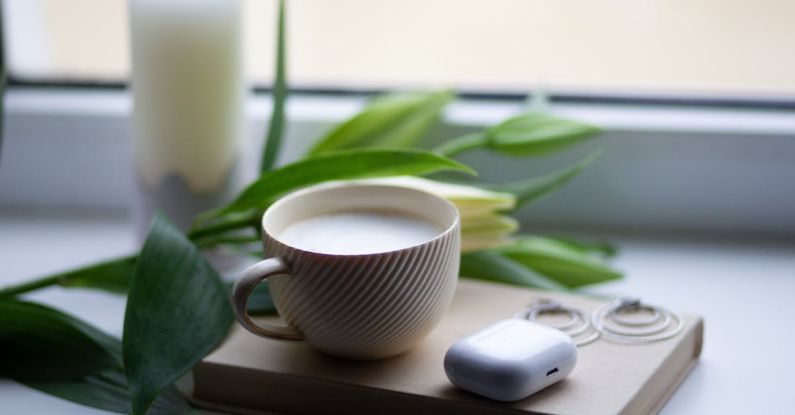 5G Technology - A cup of coffee and a book on a window sill