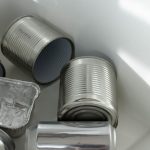 E-waste Management - Photograph of Empty Cans on a White Surface