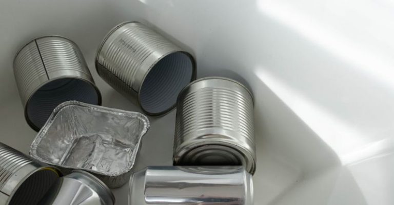 E-waste Management - Photograph of Empty Cans on a White Surface