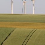 Telecommuting Eco - Wind Turbines on Horizon in Countryside