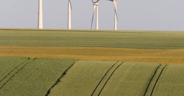 Telecommuting Eco - Wind Turbines on Horizon in Countryside