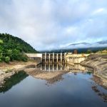 Water Conservation Tech - Hydroelectric power plant for production of eco friendly electricity on river flowing in green hilly valley