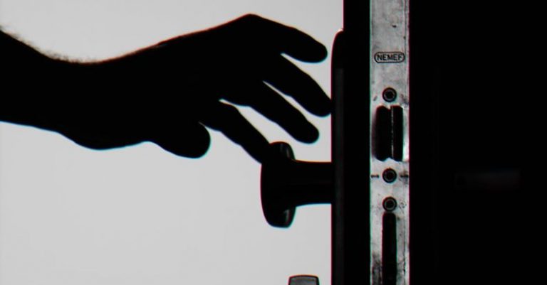 Biometric Security - Silhouette Photo of Person Holding Door Knob