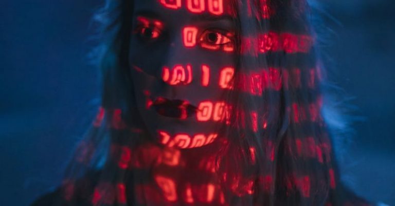 Human Cybersecurity - Woman With Red Light On Face