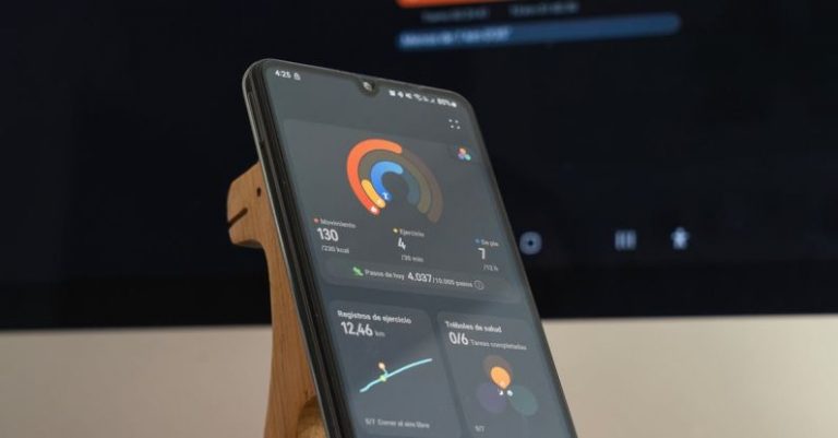 Language App - A wooden phone stand with a smartphone on it