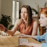 Smart Classroom - Photo Of Woman Tutoring Young Boy