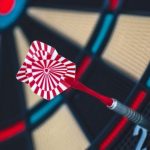Sports Data - Red and White Dart on Darts Board
