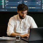 Blockchain Interoperability - Focused Professional Man using Laptop