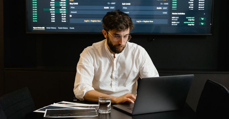 Blockchain Interoperability - Focused Professional Man using Laptop