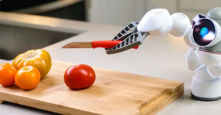 AI Surveillance - A Clicbot Slicing Holding a Knife Near Wooden Chopping Board